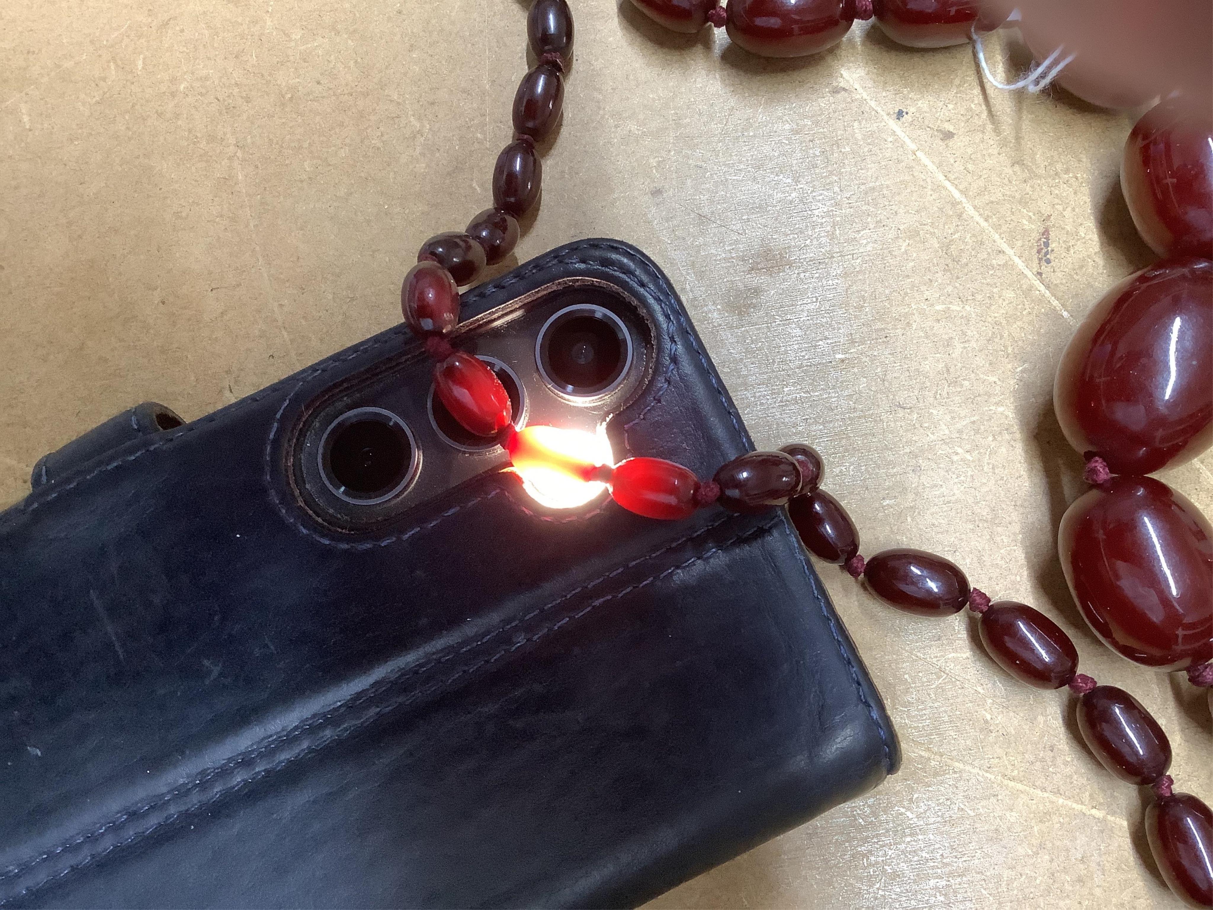 A single strand simulated cherry amber bead necklace, with graduated oval beads, 72cm, gross weight 73 grams.